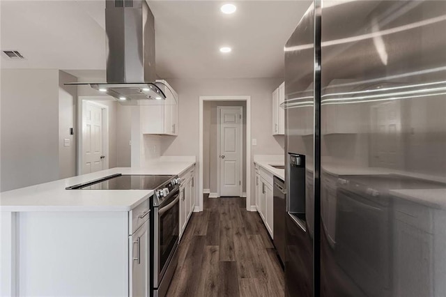 kitchen with white cabinets, appliances with stainless steel finishes, dark hardwood / wood-style flooring, and island range hood