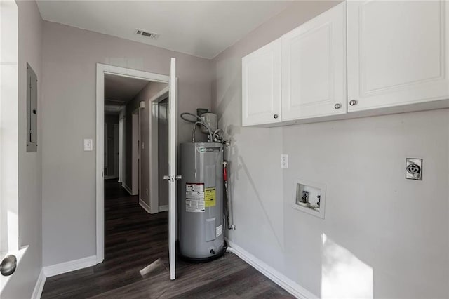 clothes washing area with water heater, cabinets, washer hookup, dark wood-type flooring, and hookup for an electric dryer