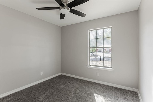 spare room featuring ceiling fan, plenty of natural light, and carpet