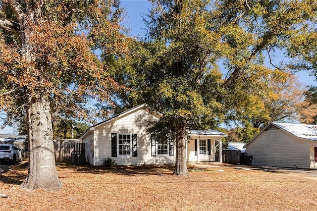 view of front facade featuring covered porch and central air condition unit