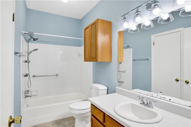 bathroom with toilet, tile patterned floors, bathing tub / shower combination, and vanity