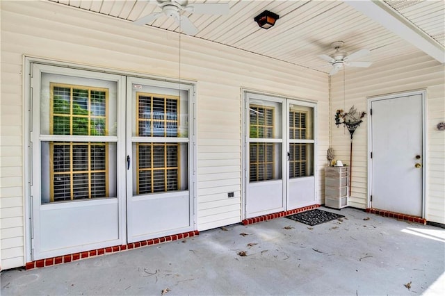 property entrance featuring a ceiling fan and a patio area