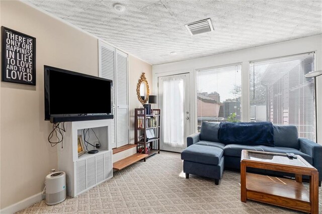 51 Jackson St N Unit A, Mobile, AL 36602 - living room featuring carpet flooring