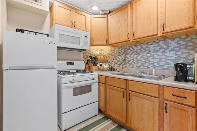 51 Jackson St N Unit A, Mobile, AL 36602 - kitchen with white appliances, light countertops, and backsplash
