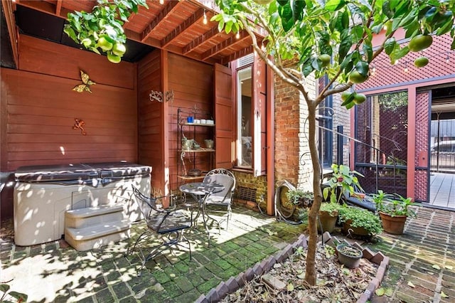 51 Jackson St N Unit A, Mobile, AL 36602 - view of patio / terrace with a hot tub