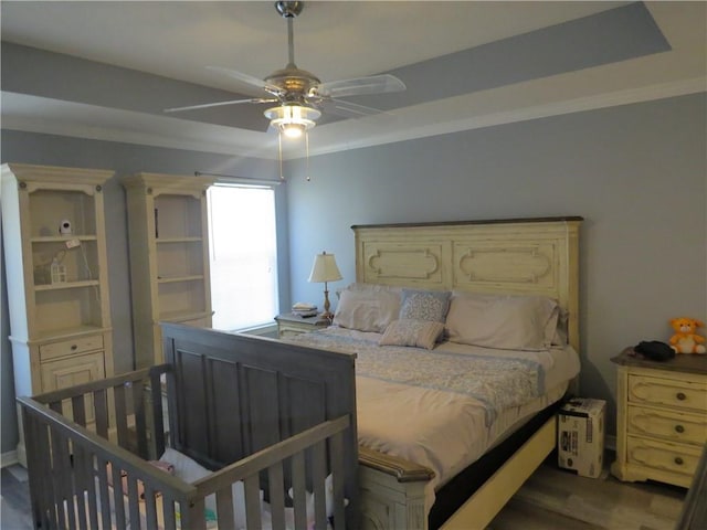 bedroom featuring ceiling fan and dark hardwood / wood-style flooring