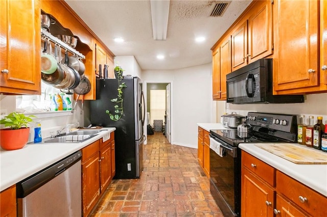 kitchen with sink and black appliances