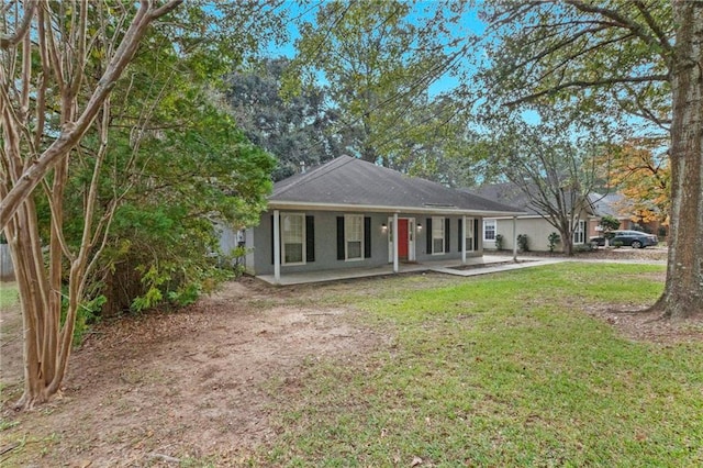 back of house featuring a yard and a patio area