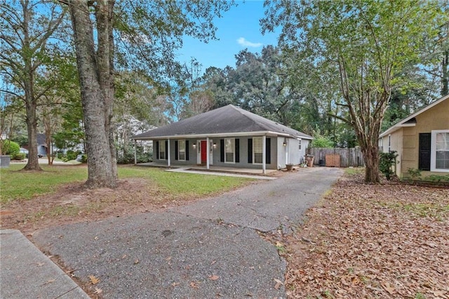 single story home featuring covered porch