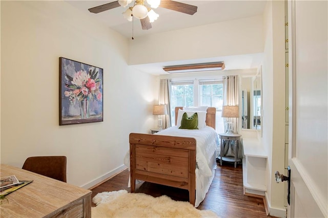 bedroom with ceiling fan and dark hardwood / wood-style flooring