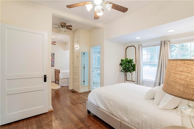 bedroom featuring dark hardwood / wood-style flooring, connected bathroom, and ceiling fan