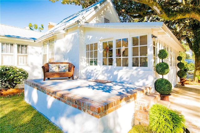 rear view of property with a patio area