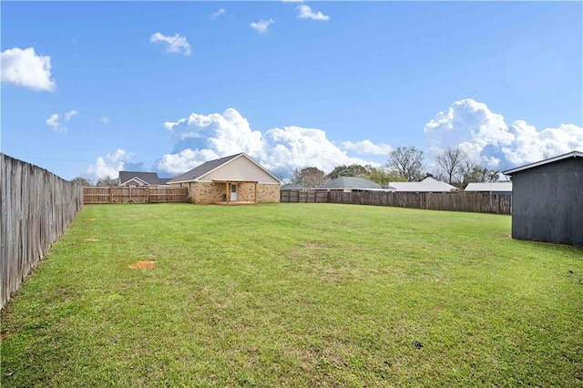 view of yard featuring a fenced backyard