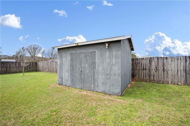 view of shed featuring a fenced backyard