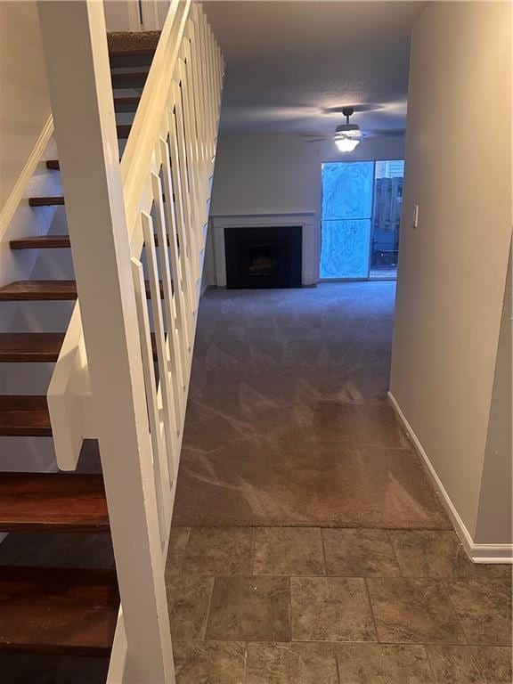 hallway featuring dark carpet