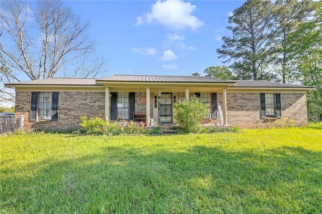 950 Red Fox Rd W, Mount Vernon, AL 36560 - single story home with brick siding and a front lawn