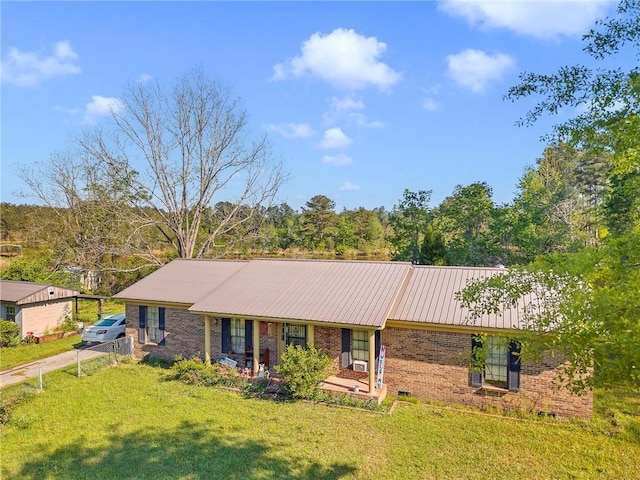 950 Red Fox Rd W, Mount Vernon, AL 36560 - single story home with metal roof, a front lawn, and brick siding