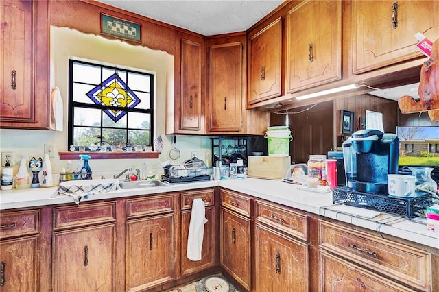 950 Red Fox Rd W, Mount Vernon, AL 36560 - kitchen featuring brown cabinets, light countertops, and a sink