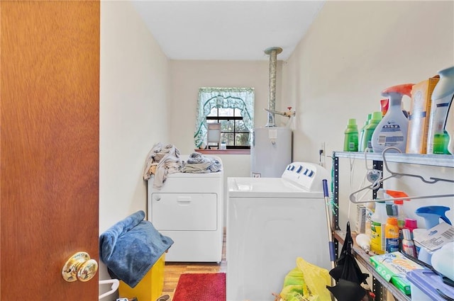 950 Red Fox Rd W, Mount Vernon, AL 36560 - washroom featuring laundry area, separate washer and dryer, wood finished floors, and water heater