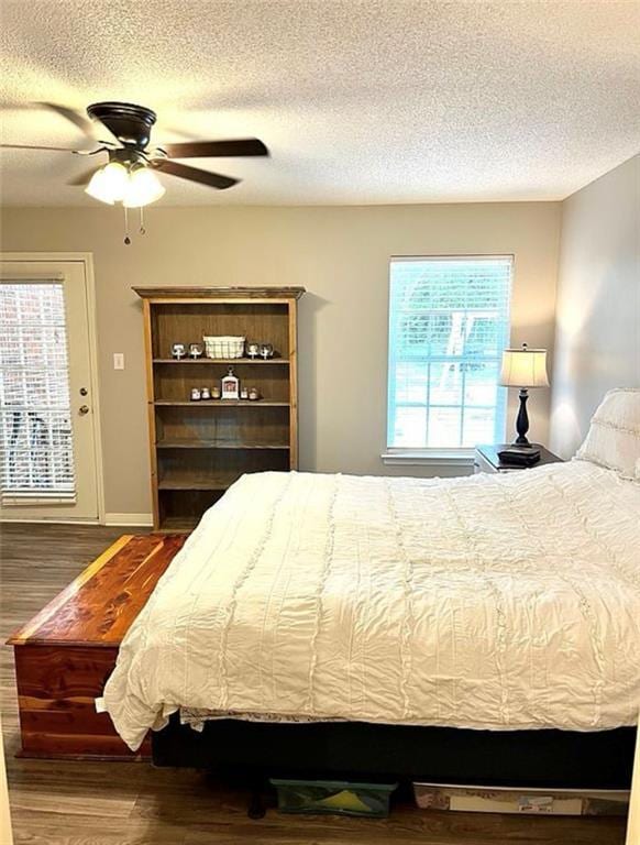 8653 Rosalene St E, Grand Bay, AL 36541 - bedroom with wood finished floors, a textured ceiling, and ceiling fan