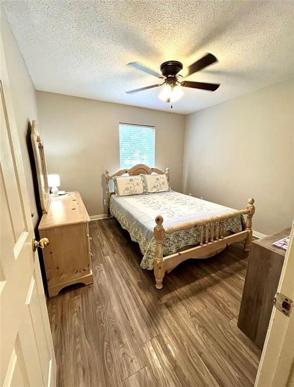 8653 Rosalene St E, Grand Bay, AL 36541 - bedroom with dark wood finished floors, a textured ceiling, and ceiling fan