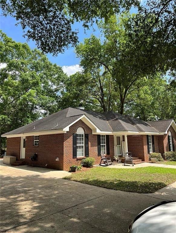 8653 Rosalene St E, Grand Bay, AL 36541 - single story home with brick siding, concrete driveway, and a front lawn