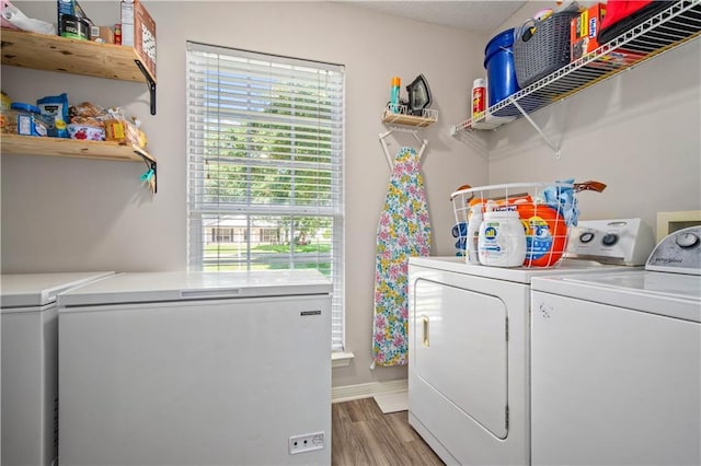 8653 Rosalene St E, Grand Bay, AL 36541 - laundry area featuring washer and dryer, light wood-type flooring, and baseboards
