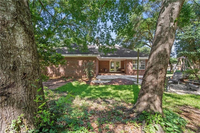 8653 Rosalene St E, Grand Bay, AL 36541 - rear view of property with brick siding, french doors, and a patio area