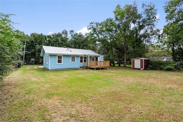 view of yard with a storage unit and a deck