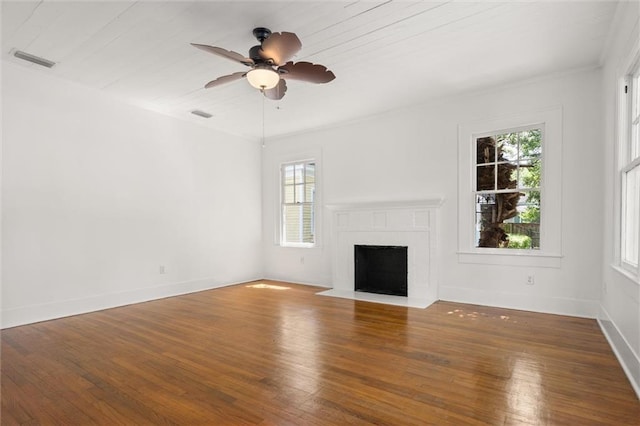 1509 Monroe St, Mobile, AL 36604 - unfurnished living room with plenty of natural light, wood-type flooring, ceiling fan, and crown molding