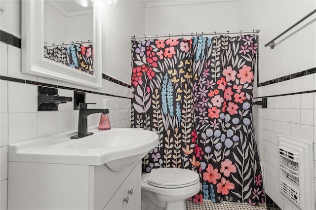1509 Monroe St, Mobile, AL 36604 - full bathroom with tile walls, vanity, a shower with curtain, and a wainscoted wall