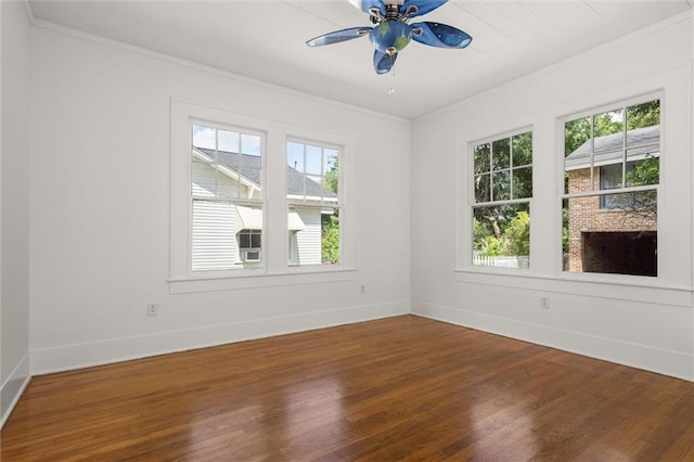 1509 Monroe St, Mobile, AL 36604 - empty room with ornamental molding, dark wood-style flooring, and a ceiling fan