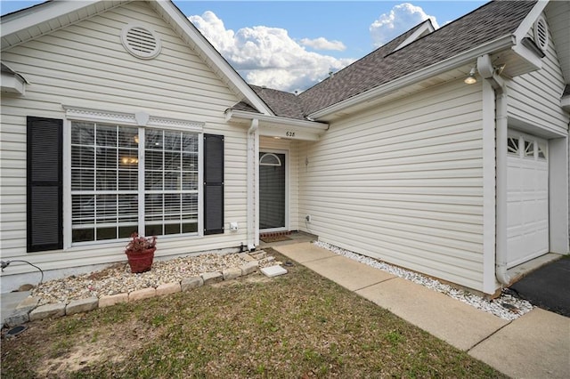 property entrance with a garage