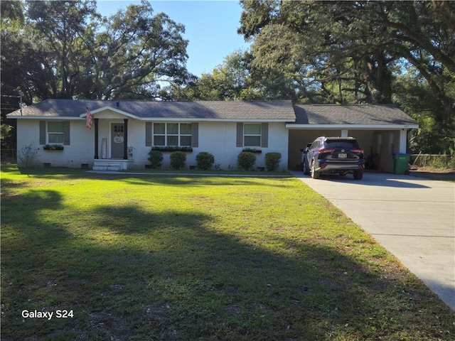 single story home with a carport, a front lawn, and a garage