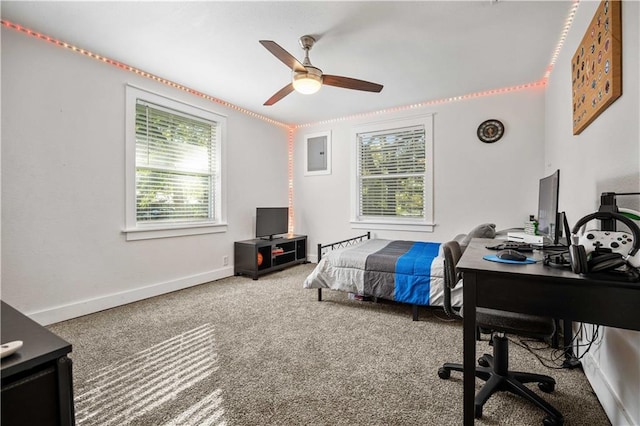 carpeted bedroom featuring electric panel and ceiling fan