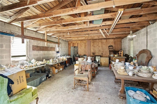 misc room featuring concrete floors and lofted ceiling