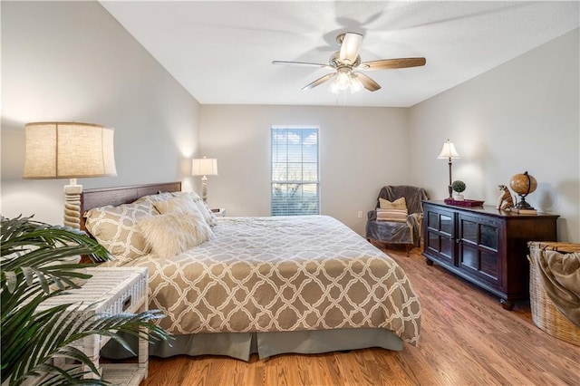 bedroom with hardwood / wood-style flooring and ceiling fan