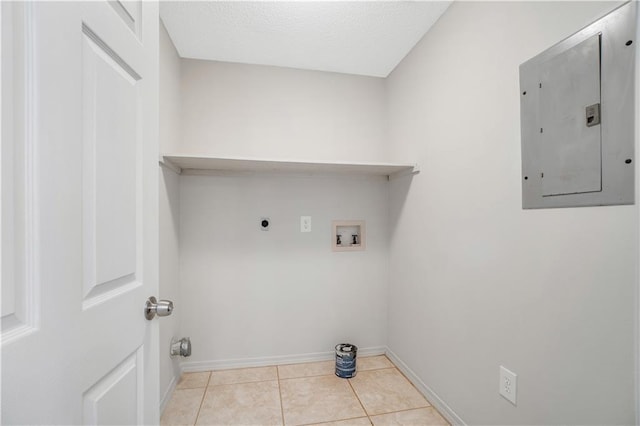 laundry room featuring hookup for an electric dryer, hookup for a washing machine, electric panel, and light tile patterned flooring