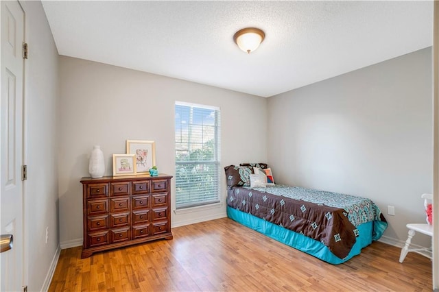 bedroom featuring hardwood / wood-style floors