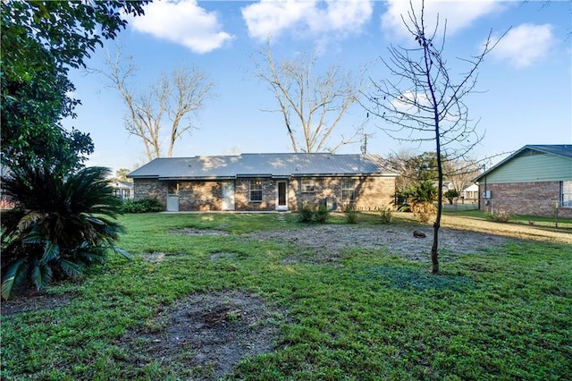 exterior space featuring a front lawn