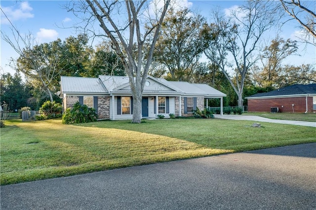 single story home with a front lawn and a carport