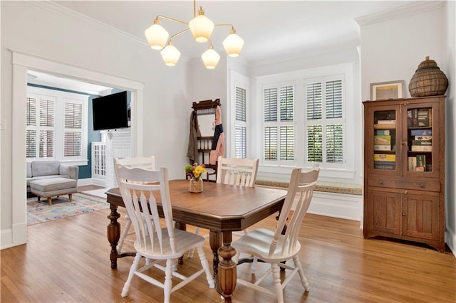 303 Monterey St S, Mobile, AL 36604 - dining area with a chandelier, light wood-style flooring, ornamental molding, and baseboards