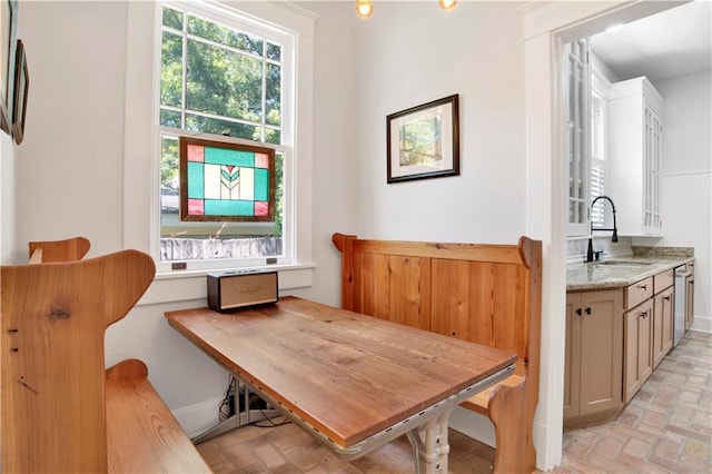 303 Monterey St S, Mobile, AL 36604 - dining area featuring brick floors and baseboards