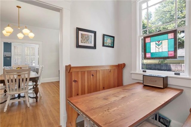 303 Monterey St S, Mobile, AL 36604 - dining space with a chandelier, wood finished floors, and baseboards