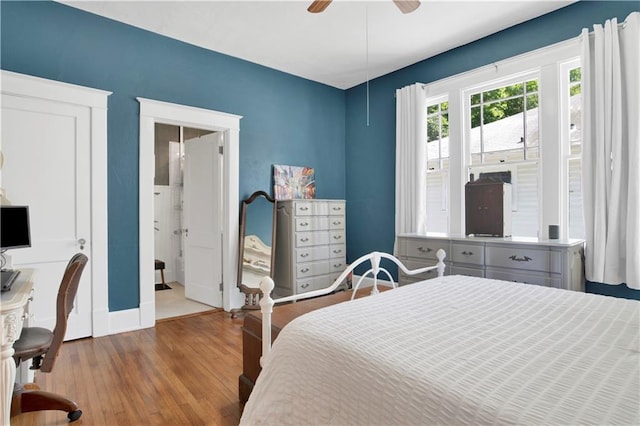 303 Monterey St S, Mobile, AL 36604 - bedroom featuring baseboards, wood finished floors, an office area, and a ceiling fan