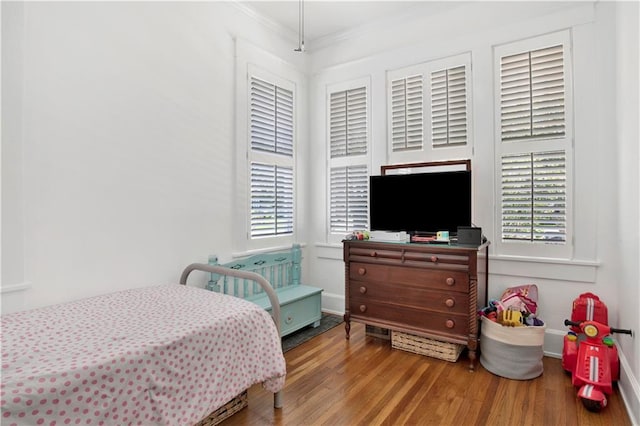 303 Monterey St S, Mobile, AL 36604 - bedroom with ornamental molding, wood finished floors, multiple windows, and baseboards