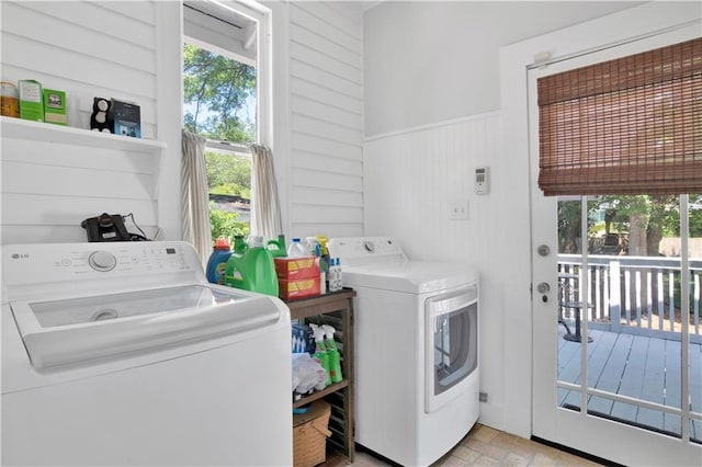 303 Monterey St S, Mobile, AL 36604 - laundry room with washing machine and clothes dryer, healthy amount of natural light, a wainscoted wall, and wood walls