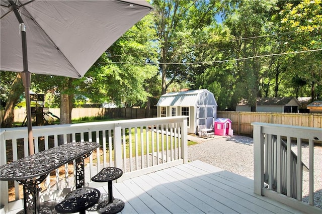 303 Monterey St S, Mobile, AL 36604 - wooden deck with a fenced backyard and view of wooded area
