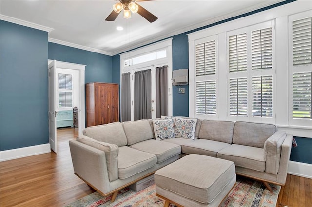 303 Monterey St S, Mobile, AL 36604 - living room with ceiling fan, baseboards, wood finished floors, and ornamental molding