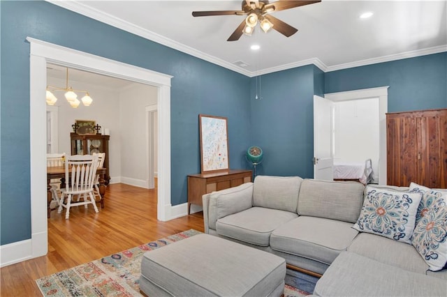 303 Monterey St S, Mobile, AL 36604 - living room with ceiling fan, wood finished floors, baseboards, ornamental molding, and a chandelier